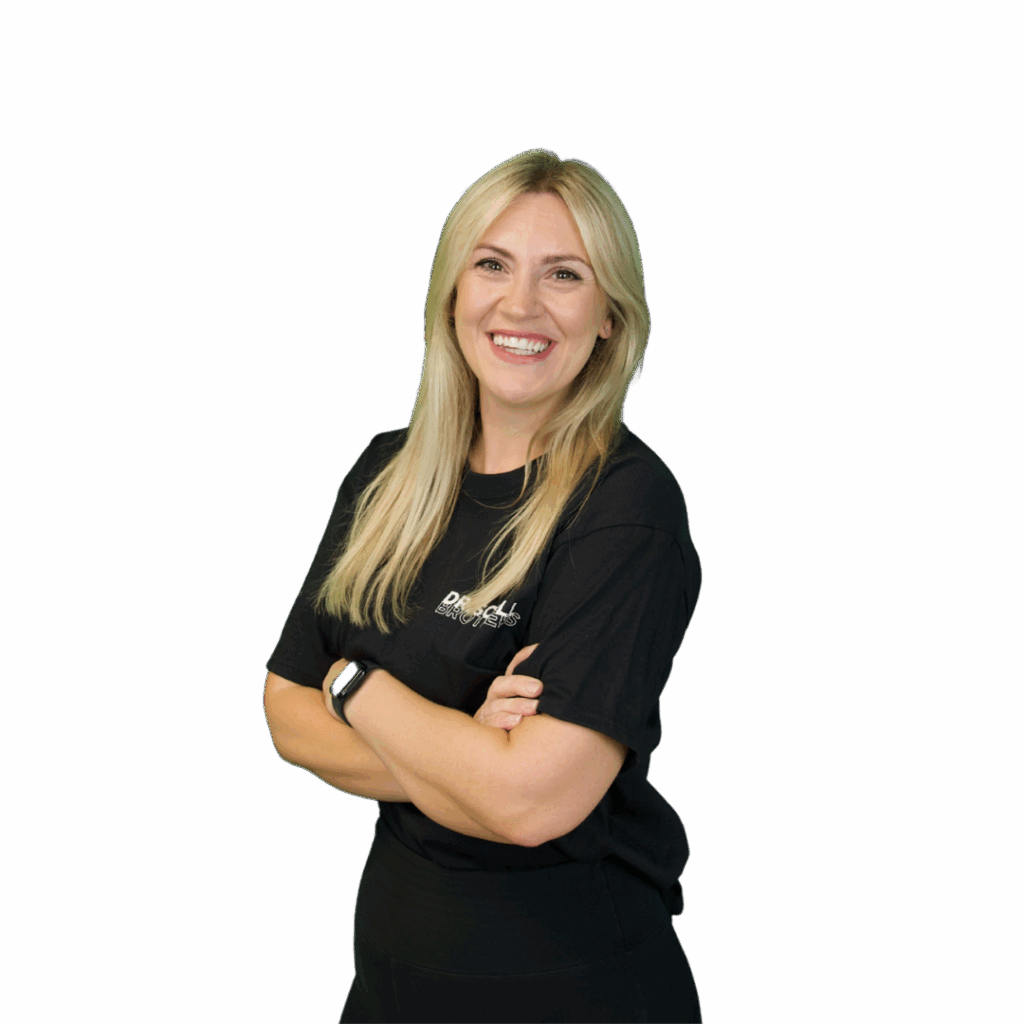 A picture of Katie stood on an angle with her arms folded