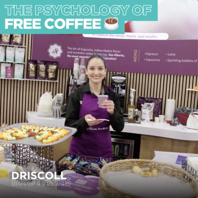 A picture of a barista smiling holding a coffee with the title of 'The psychology of free coffee' in the corner