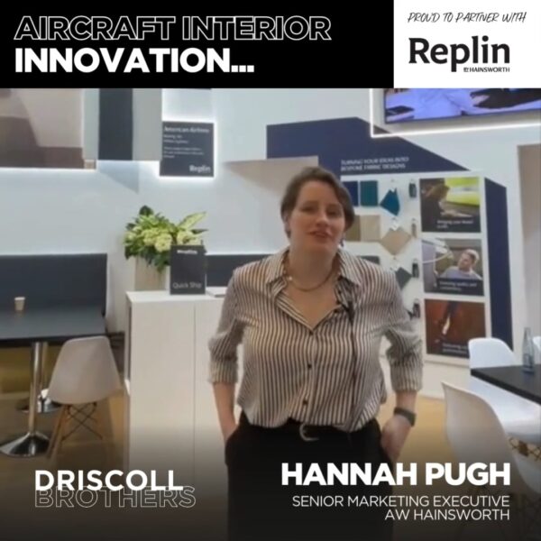 A picture of Hannah Pugh in the Replin booth giving her testimonial with the Replin logo and Driscoll Brothers logo