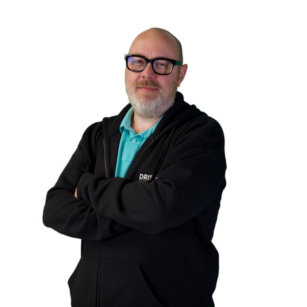 A picture of Paul stood on an angle with his arms folded