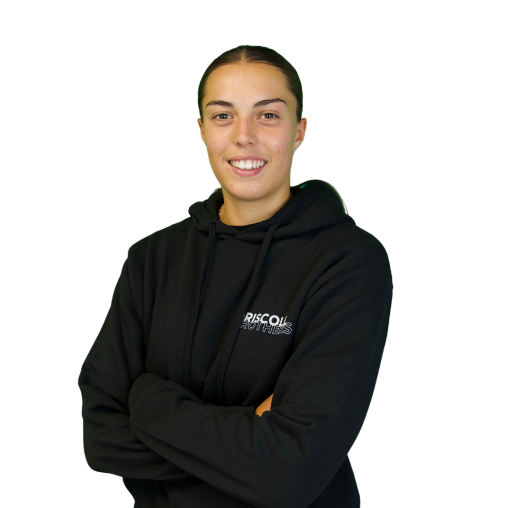 A picture of Poppy stood on an angle with her arms folded