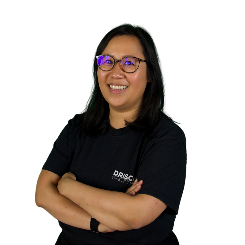 A picture of Vicki stood on an angle with her arms folded